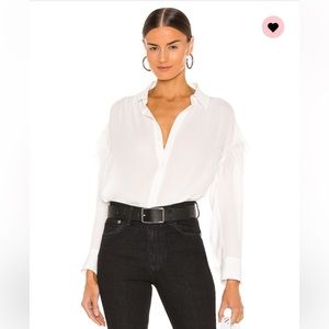 White button down with feathers on sleeves